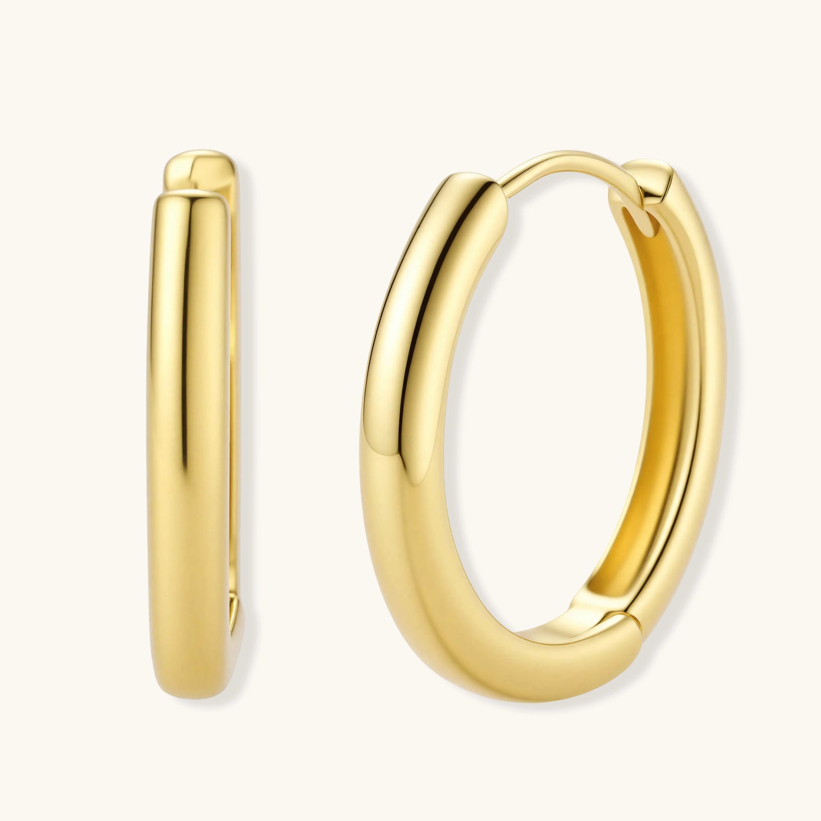 Polished gold-plated sterling silver hoop earrings with hinged closure mechanism on white background.