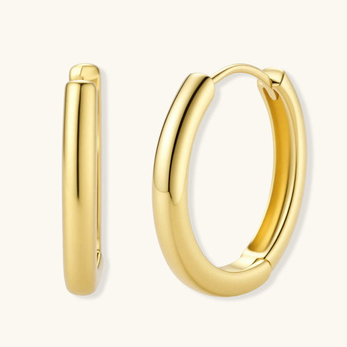 Polished gold-plated sterling silver hoop earrings with hinged closure mechanism on white background.