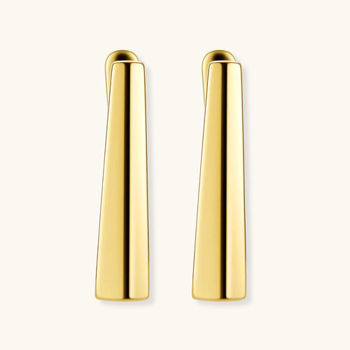 Sleek 14K gold-plated sterling silver huggie earrings with polished finish and geometric elongated design on white background.